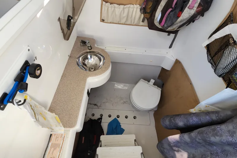 Slide: The Image of Interior of 2015 Southport 29 Tournament Edition boat with sink and toilet. - 30