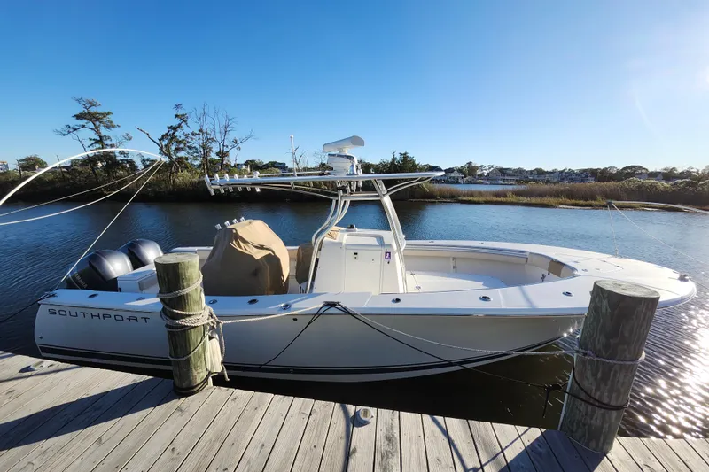 Slide: The Image of 2015 Southport 29 Tournament Edition boat docked by a serene waterfront. - 5