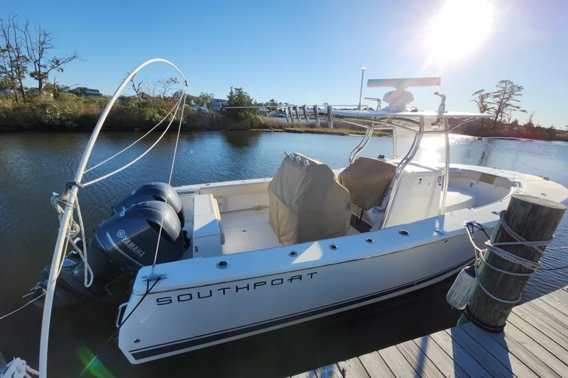 Slide: The Image of 2015 Southport 29 Tournament Edition boat docked on a sunny day. - 7