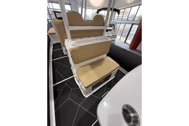 Slide: The Image of 2026 Highfield Sport 800 boat interior with tan cushioned seating and modern design. - 21