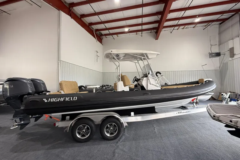 Slide: The Image of 2026 Highfield Sport 800 boat on trailer in indoor showroom. - 4