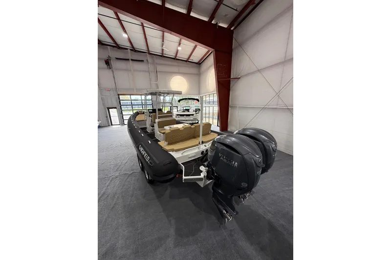 Slide: The Image of 2026 Highfield Sport 800 boat with dual Yamaha engines in a showroom. - 6