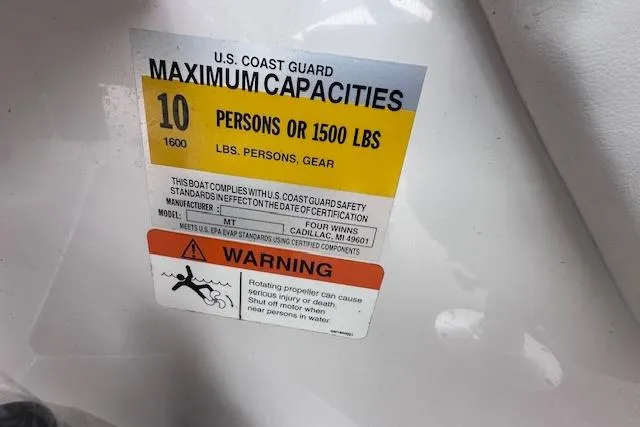 Slide: The Image of U.S. Coast Guard capacity label on 2013 Four Winns H210SS boat, 10 persons or 1500 lbs. - 17
