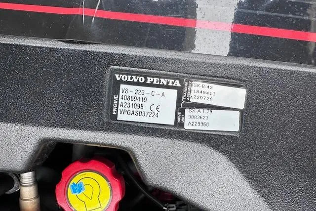 Slide: The Image of Volvo Penta engine label on 2013 Four Winns H210SS boat, featuring model and serial numbers. - 22