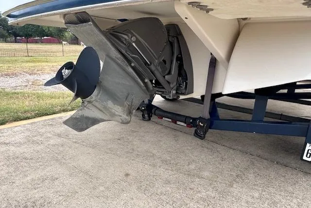 Slide: The Image of 2013 Four Winns H210SS boat propeller and stern drive on a trailer. - 8