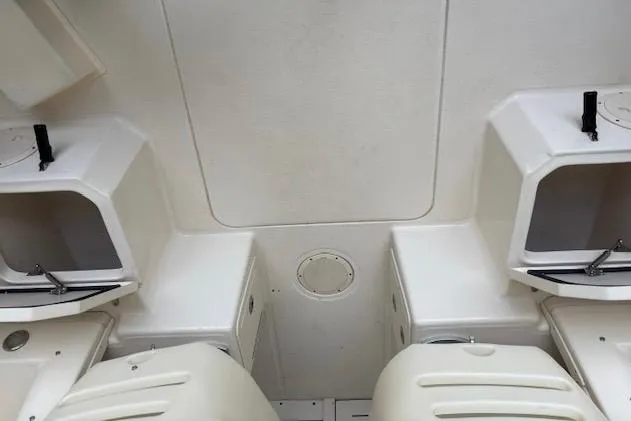 Slide: The Image of 2015 Grady-White Adventure 208 boat interior with storage compartments. - 12