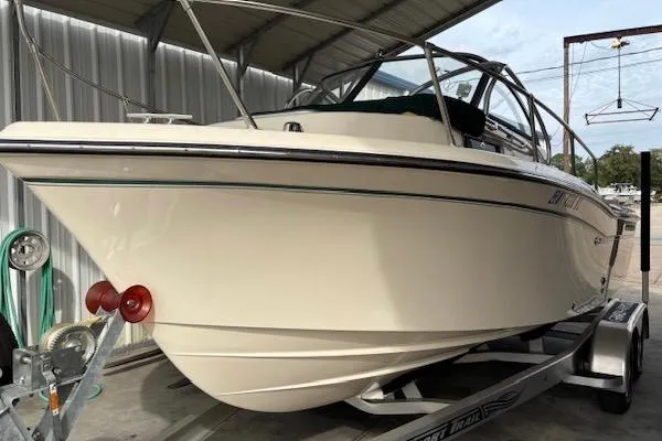 Slide: The Image of 2015 Grady-White Adventure 208 boat on trailer in covered storage. - 3