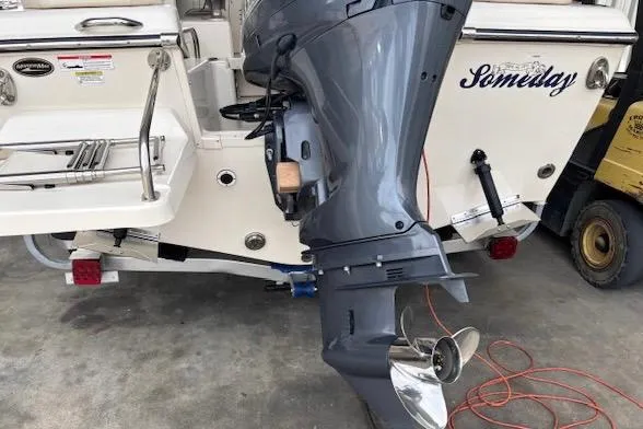 Slide: The Image of 2015 Grady White 208 Adventure boat with outboard motor, docked on concrete surface. - 5