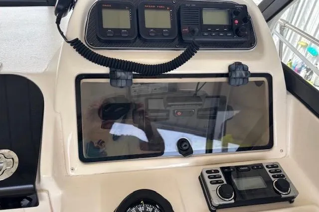 Slide: The Image of Control panel of 2015 Grady-White Adventure 208 boat with navigation instruments. - 7