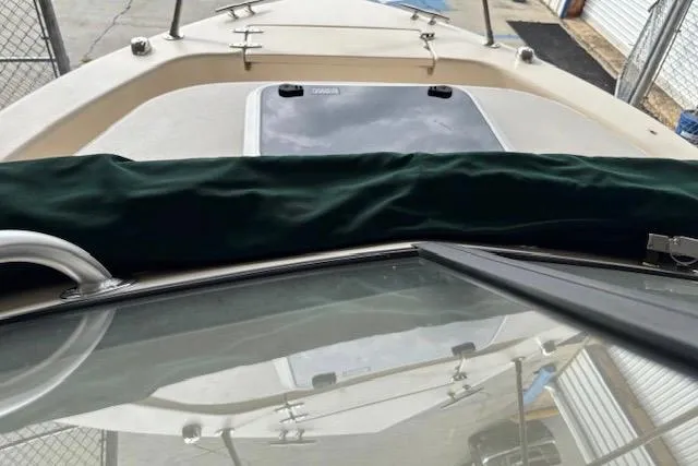 Slide: The Image of 2015 Grady-White Adventure 208 boat deck with windshield and hatch cover. - 9