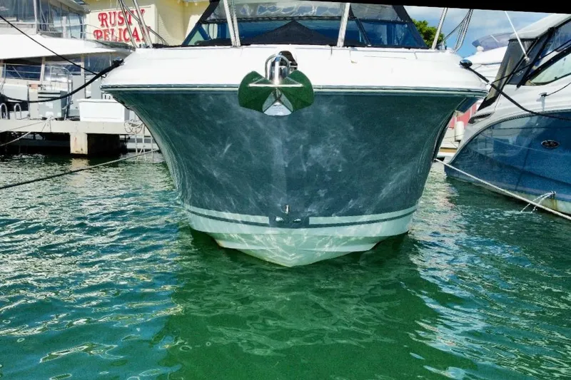 Slide: The Image of 2022 Sea Ray Sundancer 320 Outboard docked in marina, front view. - 13