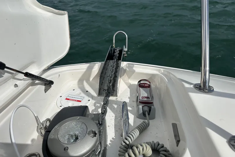 Slide: The Image of 2022 Sea Ray Sundancer 320 Outboard anchor system with chain and controls on deck. - 18