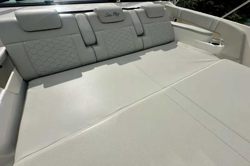 Slide: The Image of 2022 Sea Ray Sundancer 320 Outboard, luxurious white leather seating detail. - 20