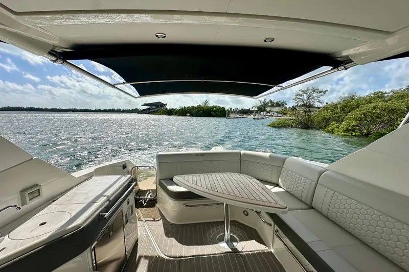 Slide: The Image of 2022 Sea Ray Sundancer 320 Outboard interior with scenic water view. - 24