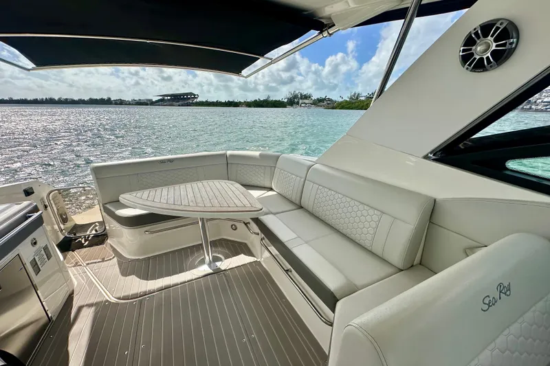 Slide: The Image of 2022 Sea Ray Sundancer 320 Outboard interior with elegant seating and scenic water view. - 26
