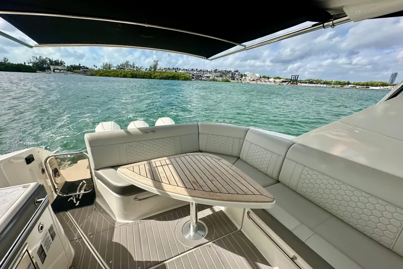 Slide: The Image of 2022 Sea Ray Sundancer 320 Outboard, elegant seating area with scenic water view. - 27
