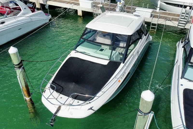 Slide: The Image of 2022 Sea Ray Sundancer 320 Outboard docked in marina, aerial view. - 4