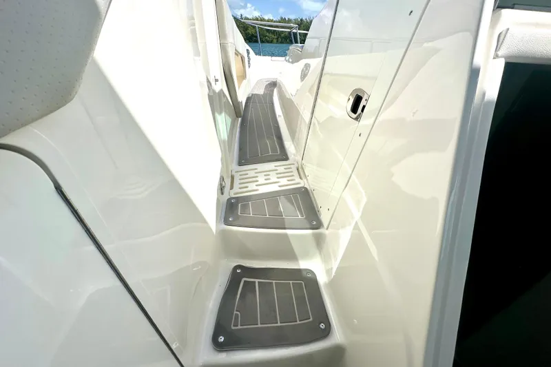 Slide: The Image of 2022 Sea Ray Sundancer 320 Outboard deck walkway with non-slip surface. - 47