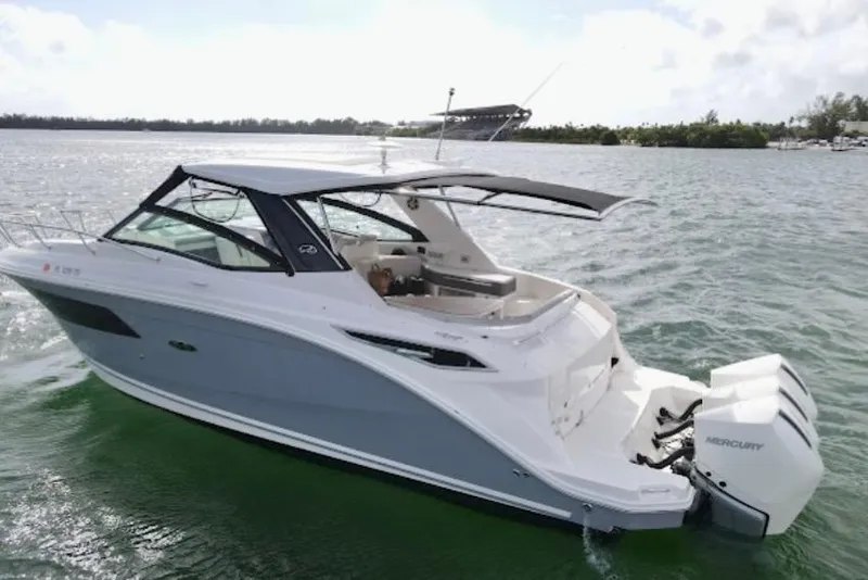Slide: The Image of 2022 Sea Ray Sundancer 320 Outboard cruising on a sunny day. - 5