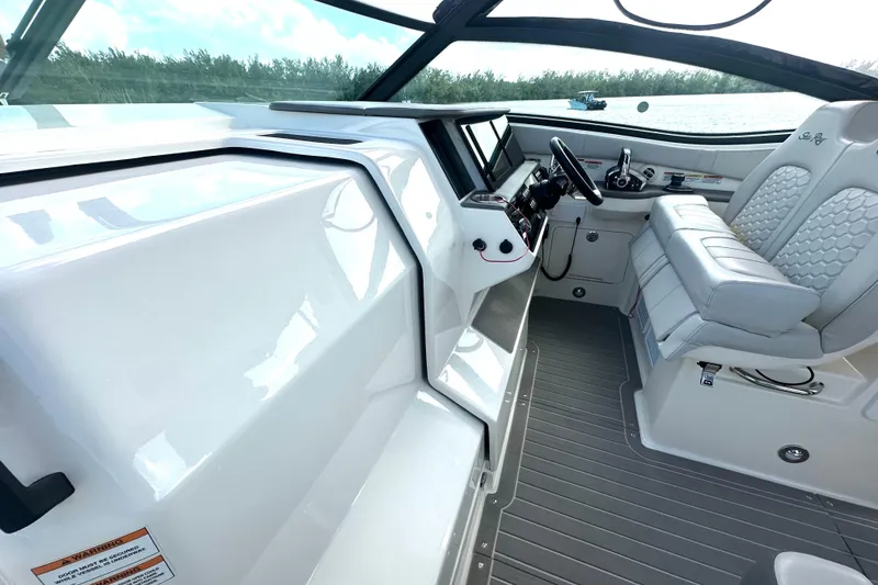 Slide: The Image of 2022 Sea Ray Sundancer 320 Outboard cockpit with modern helm and luxurious seating. - 50