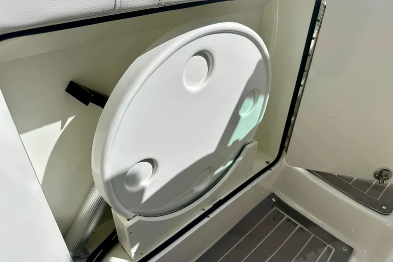Slide: The Image of 2022 Sea Ray Sundancer 320 Outboard storage compartment with round hatch cover. - 52