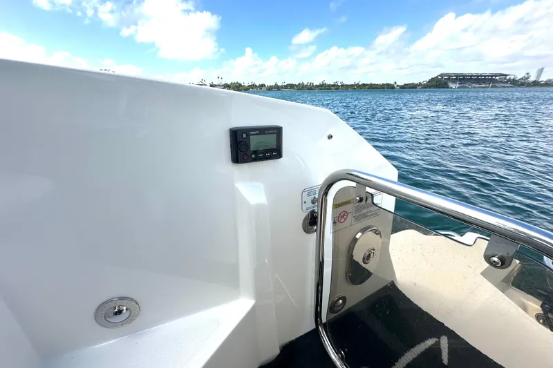 Slide: The Image of 2022 Sea Ray Sundancer 320 Outboard, deck view with water and sky background. - 53