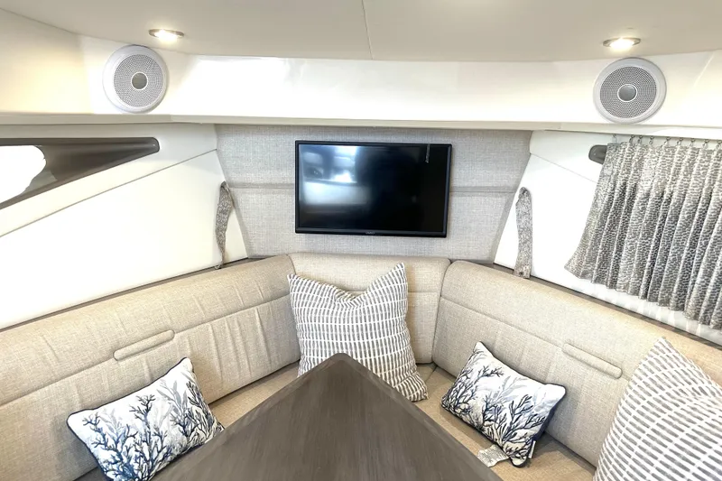Slide: The Image of Interior of 2022 Sea Ray Sundancer 320 Outboard with cozy seating and modern decor. - 65