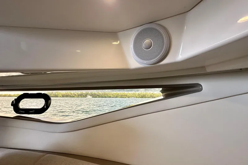 Slide: The Image of Interior view of 2022 Sea Ray Sundancer 320 Outboard with window and speaker. - 68