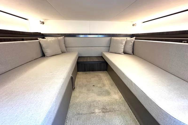 Slide: The Image of Interior cabin of 2022 Sea Ray Sundancer 320 Outboard with modern seating and cushions. - 72