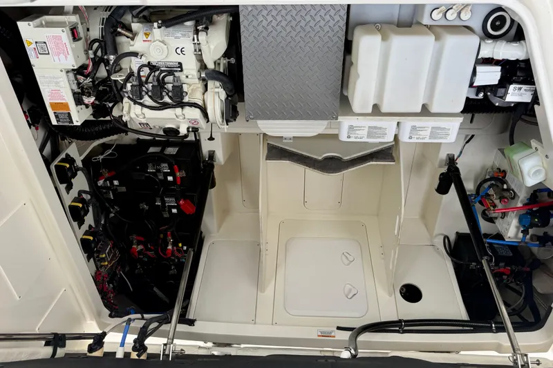 Slide: The Image of Engine compartment of 2022 Sea Ray Sundancer 320 Outboard, showcasing mechanical components. - 79