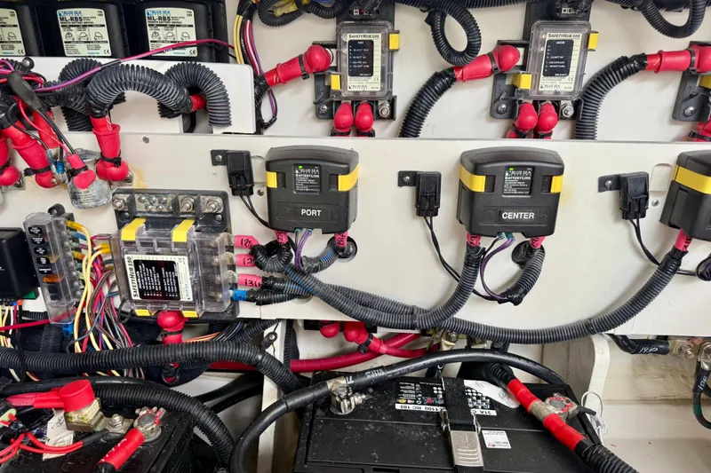 Slide: The Image of Electrical system of a 2022 Sea Ray Sundancer 320 Outboard with wiring and battery components. - 81