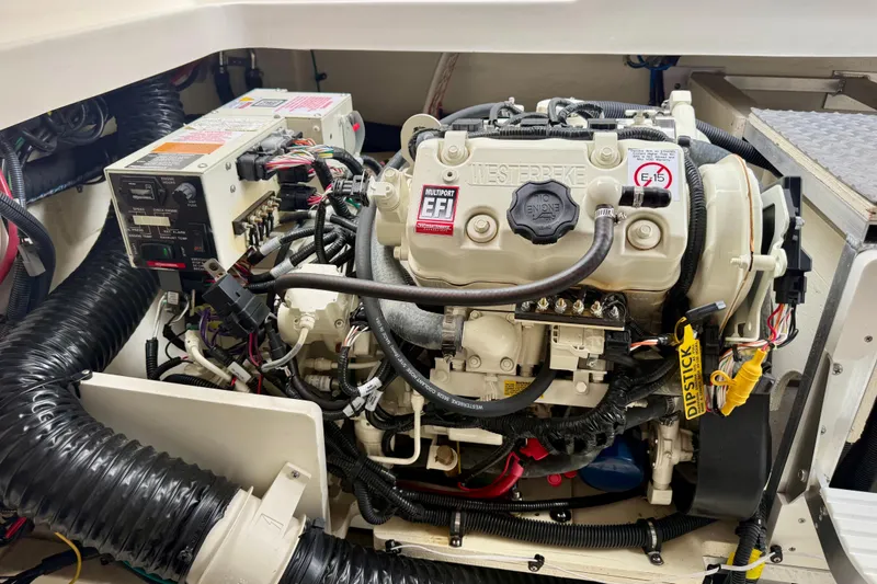 Slide: The Image of Engine compartment of 2022 Sea Ray Sundancer 320 Outboard, featuring Westerbeke EFI engine. - 82
