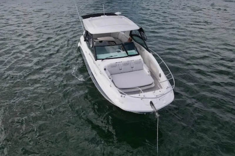 Slide: The Image of 2022 Sea Ray Sundancer 320 Outboard cruising on open water. - 9