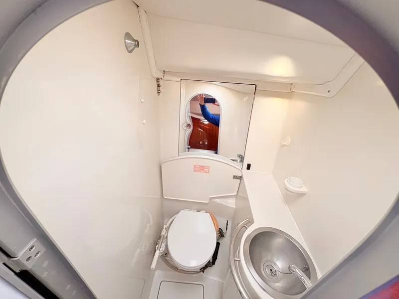 Slide: The Image of Interior of a 1990 Beneteau 38 sailboat with storage box and cover. - 36