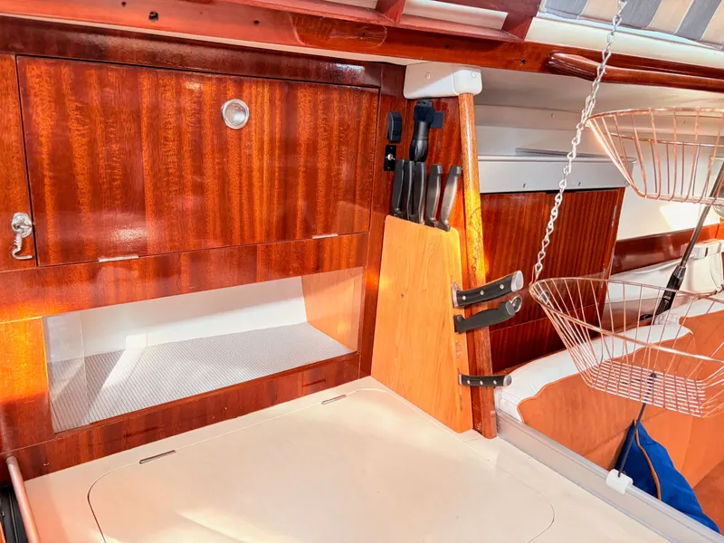 Slide: The Image of Stainless steel oven in a 1990 Beneteau 38 yacht kitchen, featuring wooden cabinetry. - 42