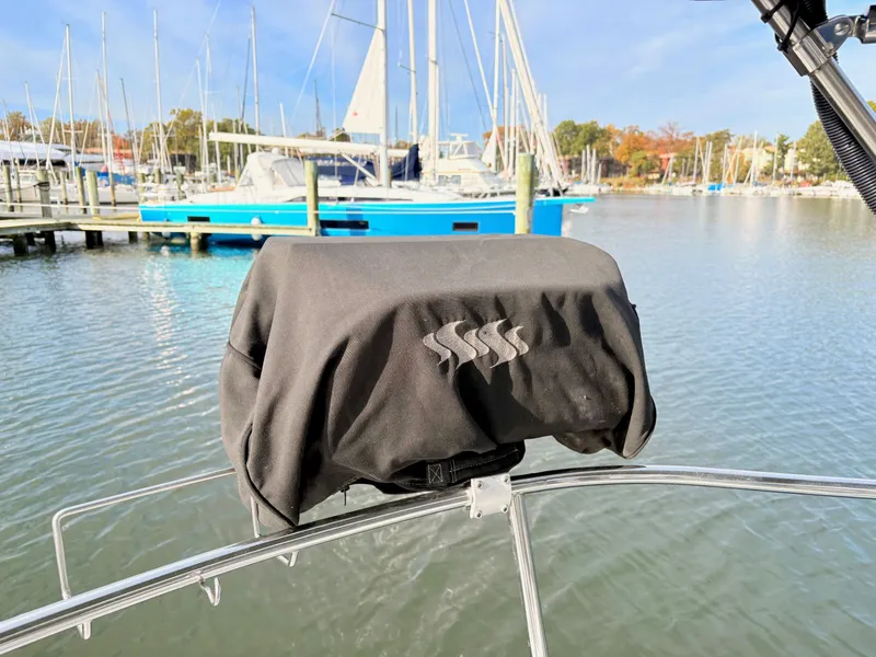 Slide: The Image of Cockpit of a 1990 Beneteau 38 sailboat, featuring a steering wheel and seating area. - 8