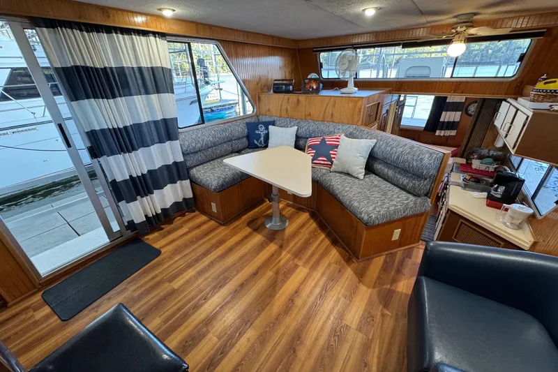 Slide: The Image of Interior of 1993 Gibson 44 Cabin Yacht with cozy seating and nautical decor. - 18