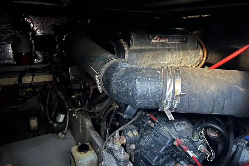 Slide: The Image of Engine compartment of a 1991 Sea Ray 400 Express Cruiser with MerCruiser components. - 16