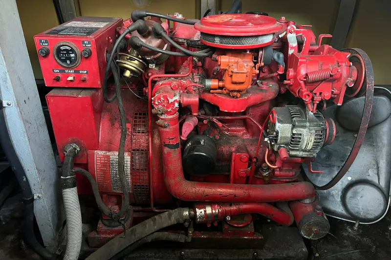 Slide: The Image of Red engine of a 1991 Sea Ray 400 Express Cruiser, featuring various mechanical components. - 17