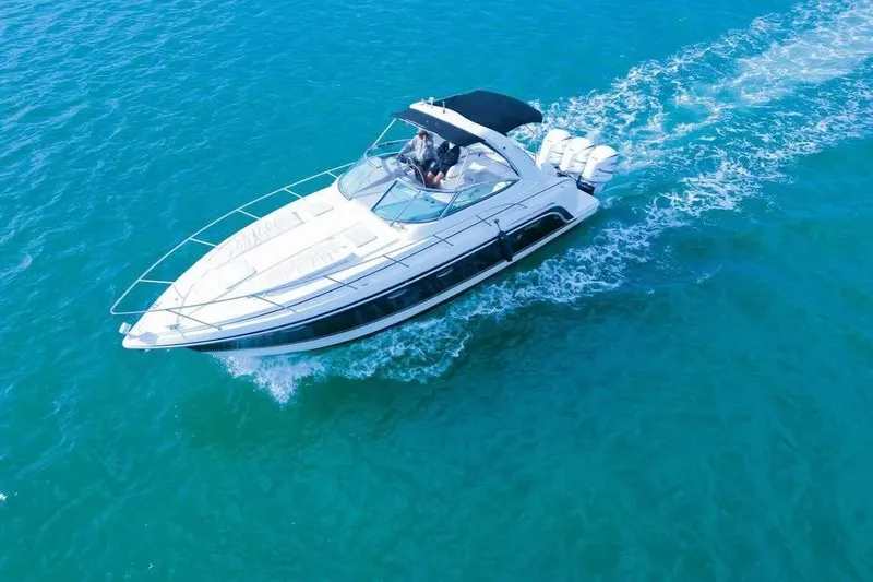 The Image of 2003 Formula 34 Performance Cruiser navigating clear blue waters. - 0