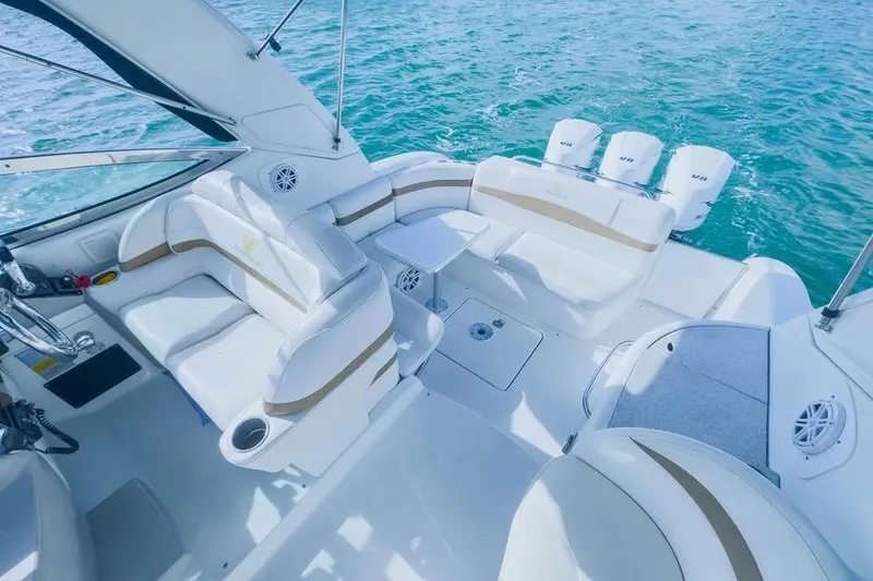 Slide: The Image of 2003 Formula 34 Performance Cruiser interior with white seating and ocean backdrop. - 6