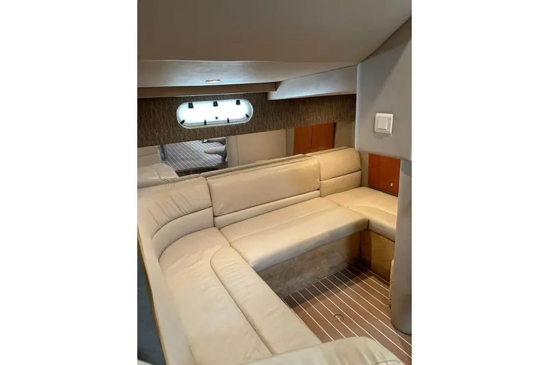 Slide: The Image of 2003 Formula 34 Performance Cruiser interior with beige seating and wood accents. - 8