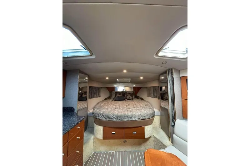 Slide: The Image of Interior of 2003 Formula 34 Performance Cruiser with cozy bed and elegant wood cabinetry. - 9