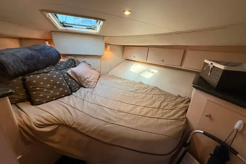 Slide: The Image of Cozy cabin interior of 1999 Carver 406 Aft Cabin Motor Yacht with bed and storage. - 20