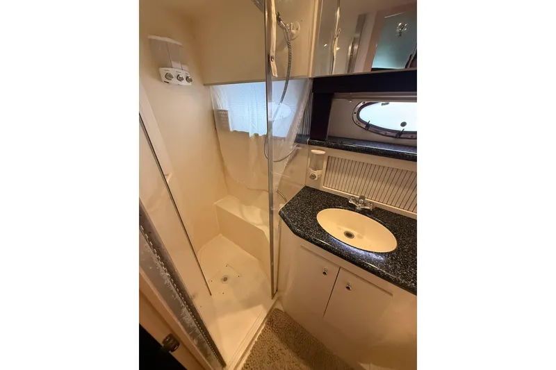 Slide: The Image of Bathroom interior of 1999 Carver 406 Aft Cabin Motor Yacht with shower and sink. - 27