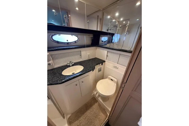 Slide: The Image of Bathroom of 1999 Carver 406 Aft Cabin Motor Yacht with sink and toilet. - 26