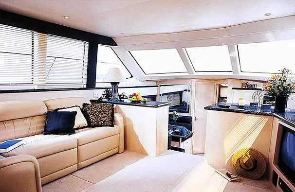 Slide: The Image of 1999 Carver 406 Aft Cabin Motor Yacht docked in marina, sunny day. - 4