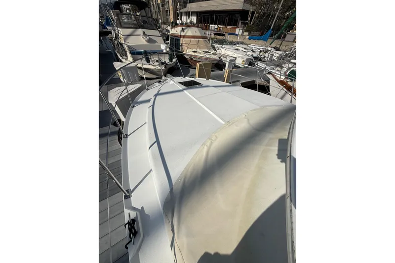 Slide: The Image of 1999 Carver 406 Aft Cabin Motor Yacht docked at marina. - 5