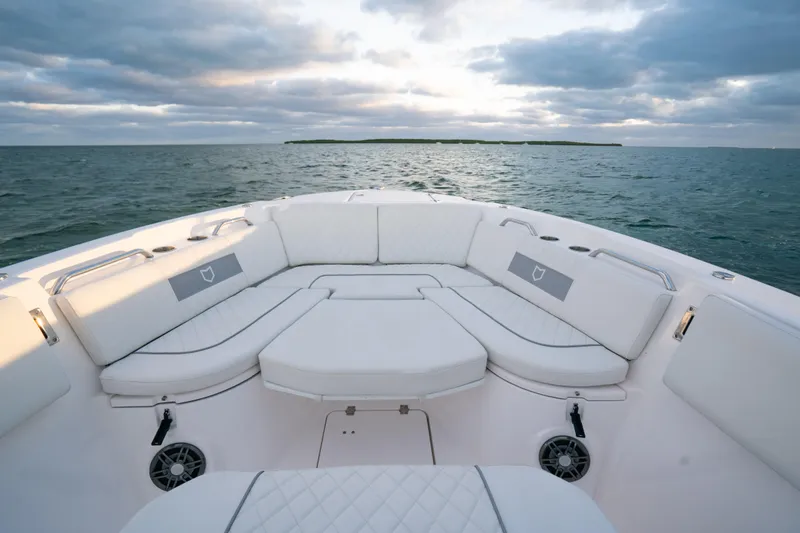 Slide: The Image of Luxurious seating on 2025 Sea Fox 268 Commander boat, ocean view at sunset. - 14