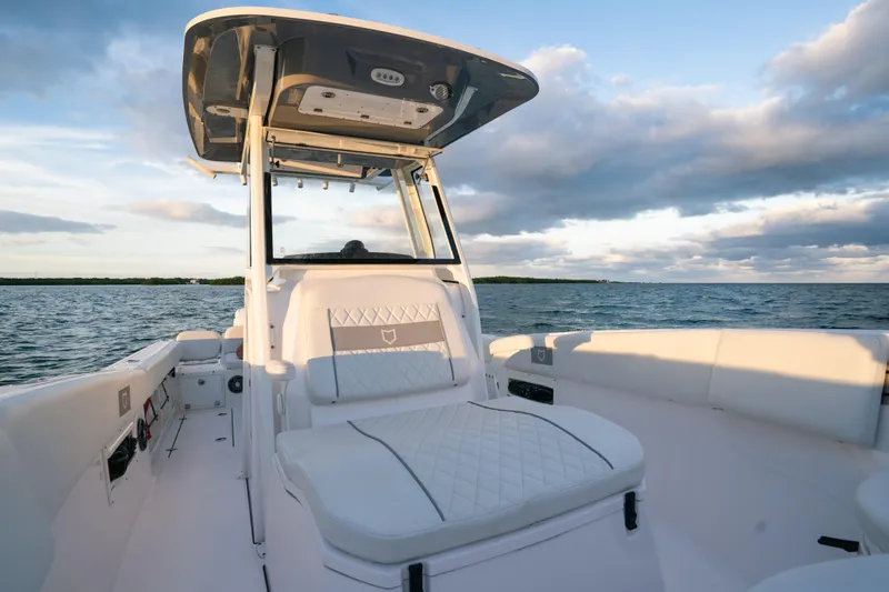 Slide: The Image of 2025 Sea Fox 268 Commander boat interior with ocean view, featuring luxurious seating and modern design. - 17